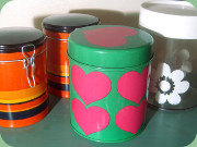 Tins by IRA Denmark and
                        Laurids Lönborg and plastic jar by Erik Kold