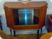 50s bar cabinet with black legs and
                          magazine shelf