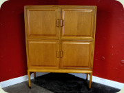 Swedish 50's 4 door
                          cabinet with shelves, moulded drawers and
                          sculptural handles, made by Bodafors