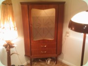 50s Swedish teak corner cabinet with
                          glass door and drawers