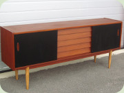 Troeds Trio Swedish
                          50's or 60's teak sideboard with 5 drawers and
                          black lacquered sliding doors, designed by
                          Nils Jonsson
