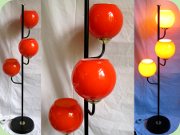 Black lacquered floor
                          lamp with 3 orange glass shades