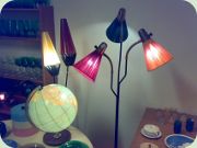 50's standard lamps
                          with shades in plastic stripes and thread.