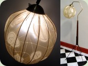 50's tripod floor lamp
                          in mahogany tainted wood, brass and black
                          lacquered metal with a round shade dressed in
                          plastic