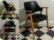 Swedish 60's oak
                          armchair upholstered in black vinyl