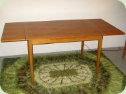 Swedish 50's teak
                          veneer dining table with dutch leaves