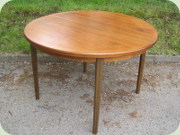 Swedish 60's round
                          walnut dining table with leaf