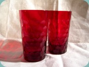 Red tumblers with
                          honeycomb pattern by Reijmyre, Sweden