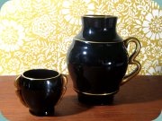 30's Art deco
                          cigarette cup and vase in black glass